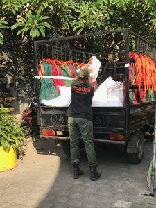 ecoBali truck picking up the bags of trash